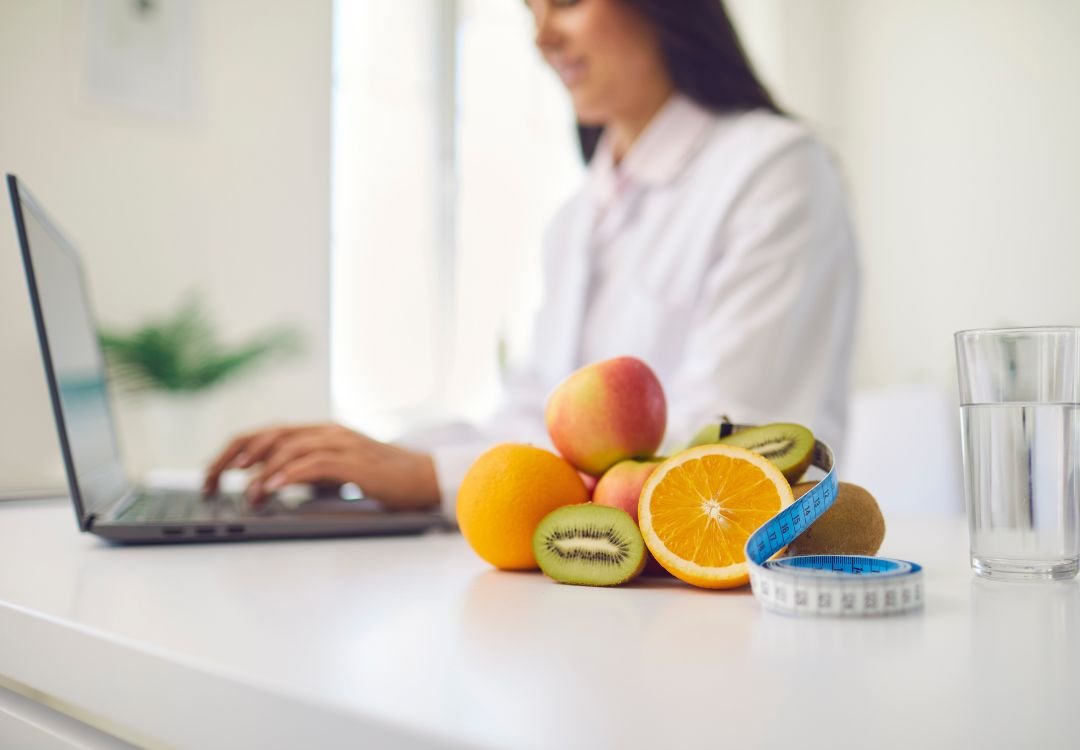Planning a wellness routine and budget at a laptop